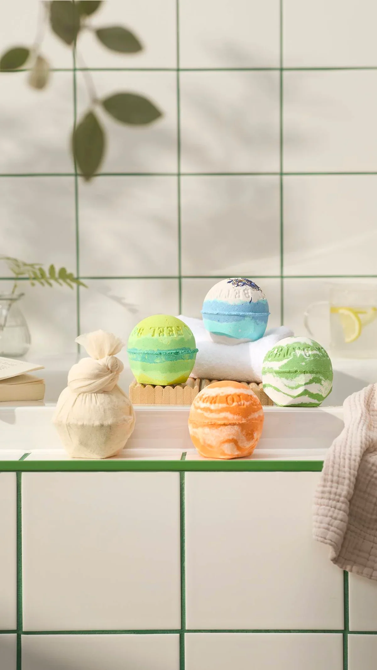 Lush colourful bath bombs on a bathroom ledge