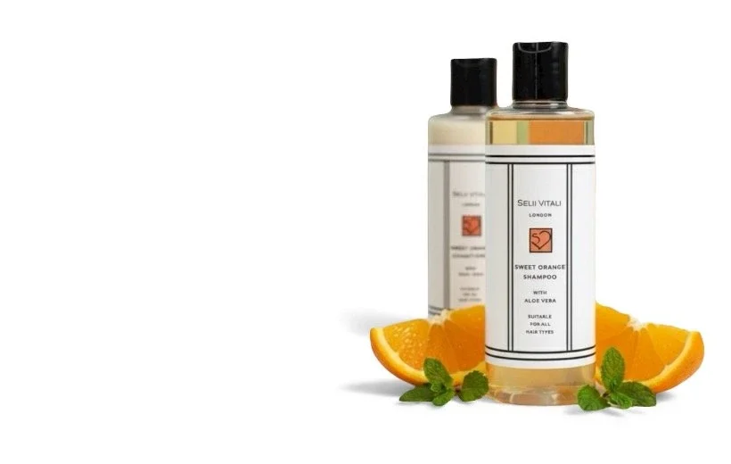 Selii Vitali skincare and haircare bottles with orange slices