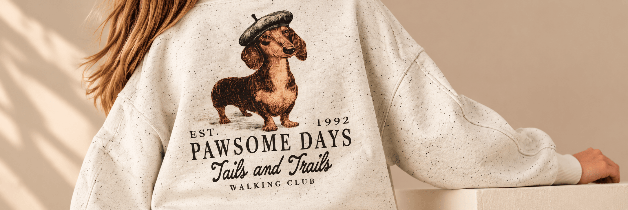 Next sweatshirt featuring a dachshund illustration