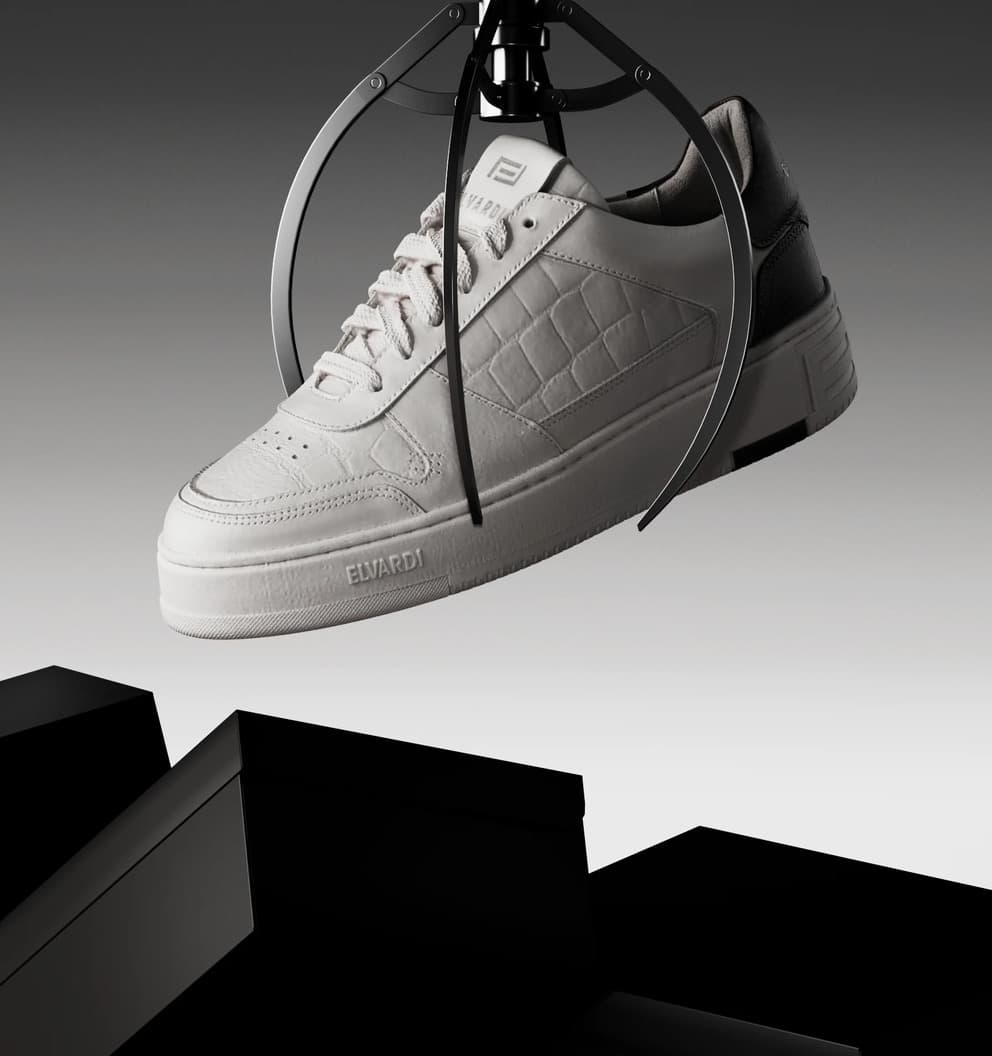 A white croc-embossed Elvardi leather trainer